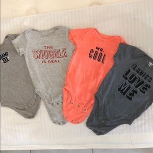 Set of four 12-18m bodysuits